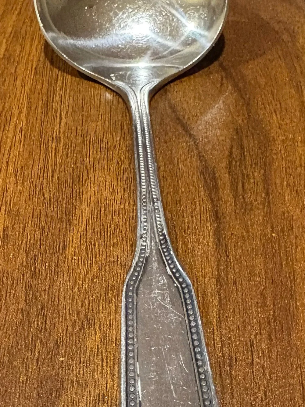 Vintage Salem 1776 stainless steel Japan satin ladle with beaded edge.